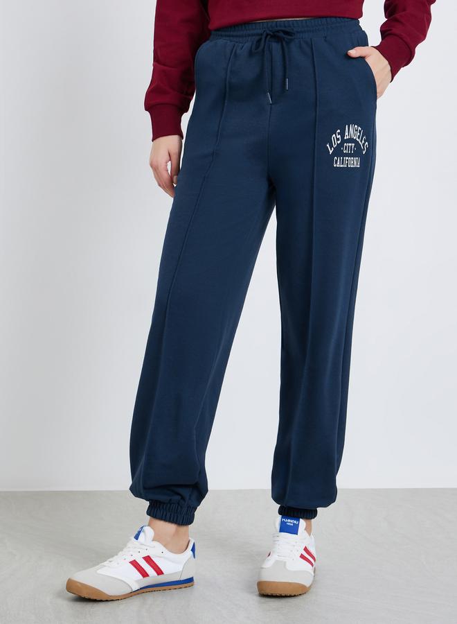 Styli Women Navy Blue Graphic Print Tapered Joggers - Image 1